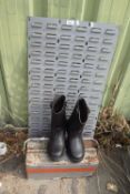 A pair of mens Dunlop safety boots together with a metal tool box and metal wall bracket