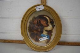 Framed picture of a dog in oval frame