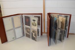 Two assorted postcard albums