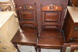 A pair of mahogany hall chairs