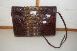 A crocodile skin leather handbag