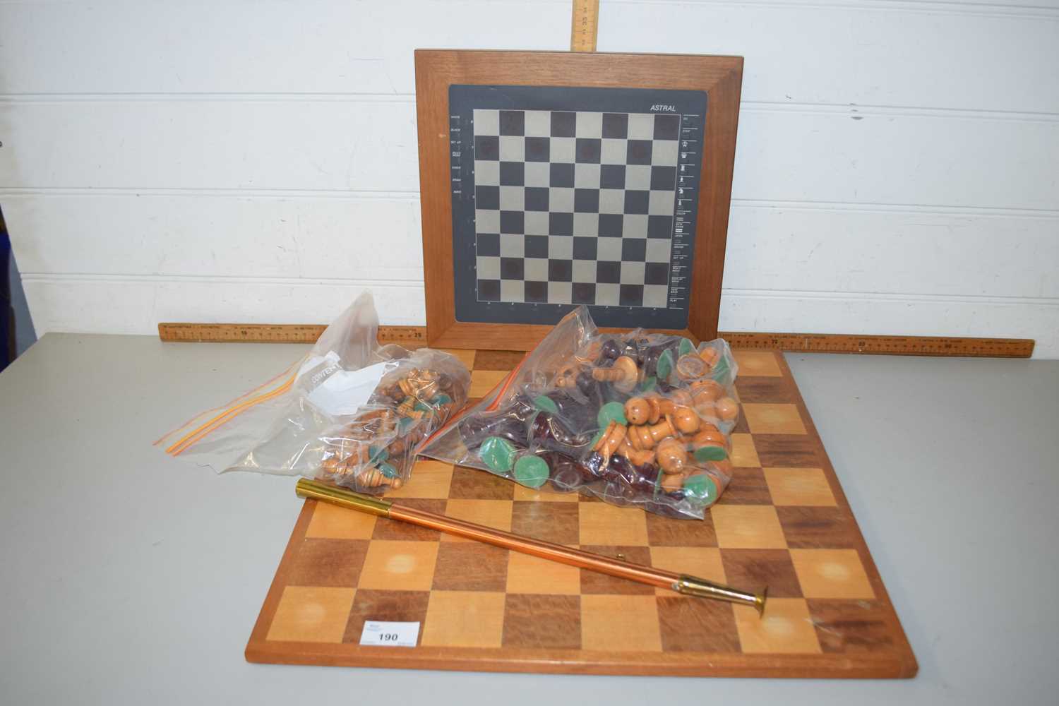 Large chess board, further board and chess pieces