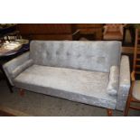 Modern pale grey velvet upholstered Clik Clak sofabed with baluster cushions