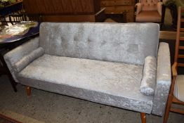 Modern pale grey velvet upholstered Clik Clak sofabed with baluster cushions