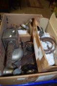 Box containing a quantity of metal items including old lamp, bell and other items