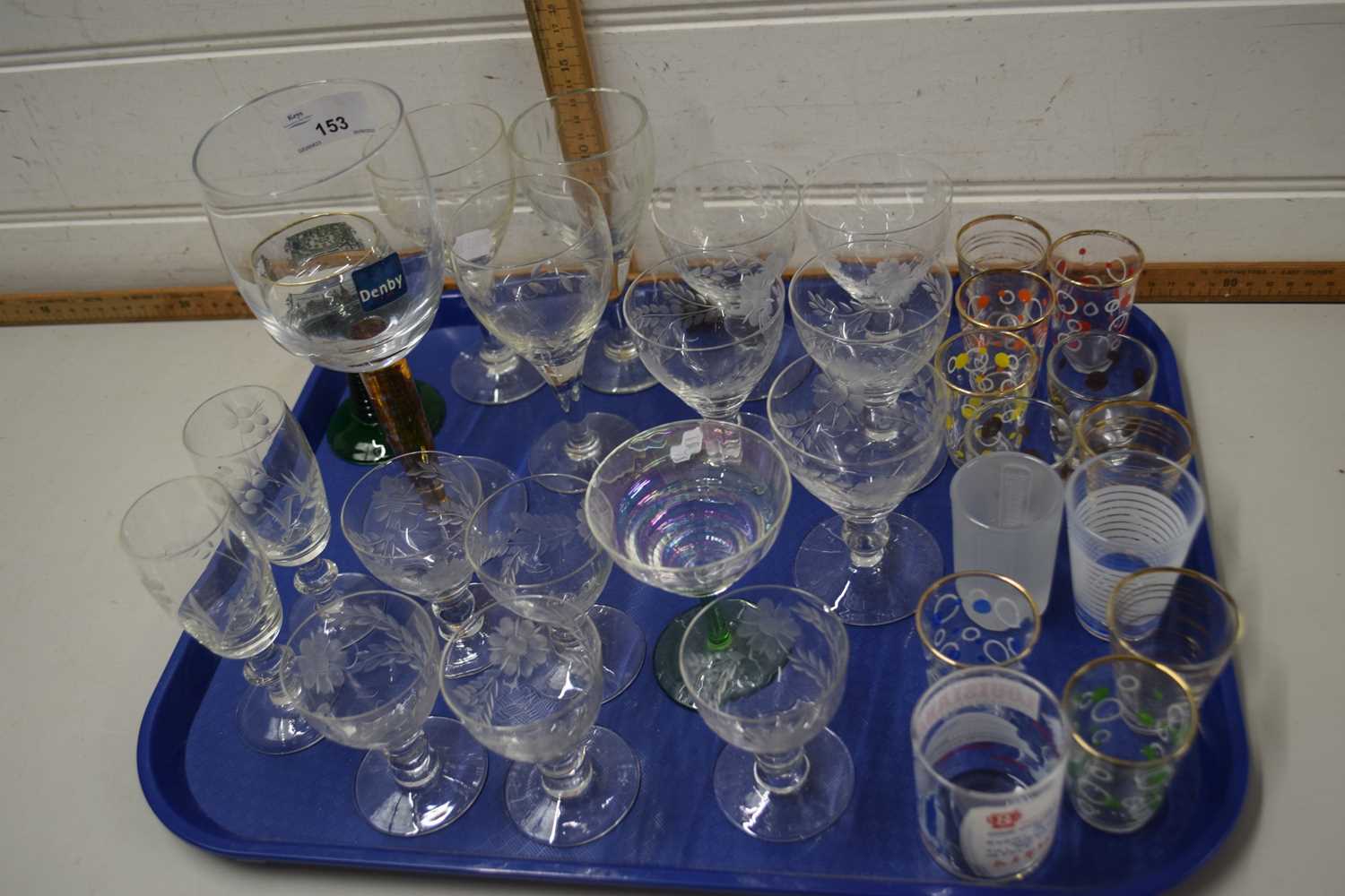 Tray of mixed glass ware together with a further tray of glass ware and red glazed vases