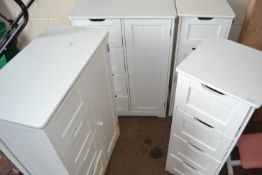 A pair of white cabinets with single cupboard and four short drawers, 56cm wide together with a