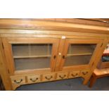 Pine sideboard with glazed cupboards and six small drawers below, 150cm wide