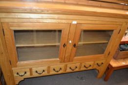 Pine sideboard with glazed cupboards and six small drawers below, 150cm wide