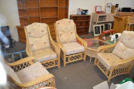 Bamboo and wicker conservatory set of four armchairs and a similar round glass top coffee table