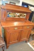 A 20th Century chiffonier with mirrored back, two drawers and cupboards below, 120cm wide