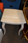 A square side table with cabriole style legs