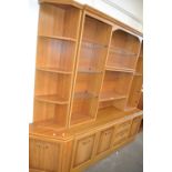 Mid to late 20th Century dresser with angled ends, glazed and wood shelves with cupboards and