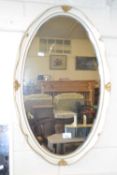 Cream and gilt decorated oval wall mirror