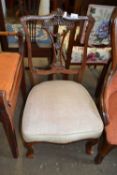 A beige upholstered nursing chair