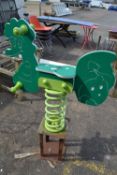 A children's outdoor spring mounted rocking horse