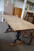 A pub style table with plank top and cast iron base, 153cm wide