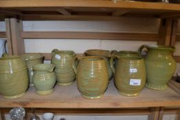 Quantity of various earthenware jugs including Burton etc