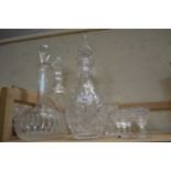 Four glass decanters with stoppers and a quantity of liqueur glasses