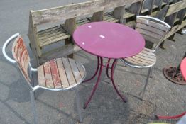 Purple bistro table with two aluminium and wooden chairs