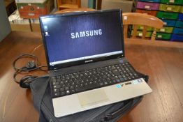 A Samsung laptop and bag
