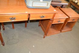 A two drawer side table with fluted legs, approx 100cm wide together with a pair of matching bedside