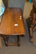 An oval drop leaf coffee table