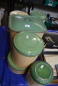 Set of six vintage green and cream painted enamel kitchen tins