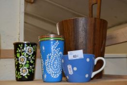 Wooden ice bucket together with four painted metal tumblers and a spotted mug