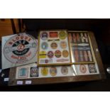 Group of three framed groups various beer labels together with a mirrored advertising pictures