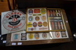 Group of three framed groups various beer labels together with a mirrored advertising pictures