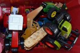 Quantity of assorted children's toys to include a Claus tractor, John Deere tractor and others