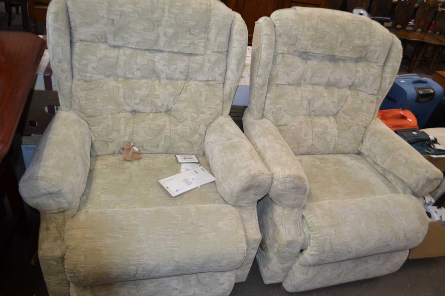 Two Lazboy armchairs in green upholstery