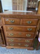 Modern mahogany chest of drawers with brass handles, 87cm wide