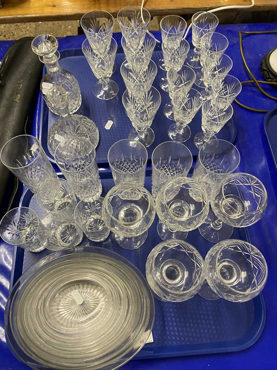 Two trays of various drinking glasses