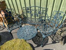 Modern metal garden two seater chair with a pair of accompanying single chairs and a small table,