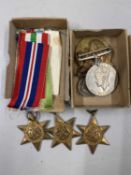 WWII Interest - A group of medals comprising the 1939-1945 Star, the Africa Star, the Italy Star,