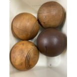 Four vintage wooden balls