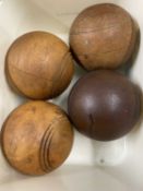 Four vintage wooden balls