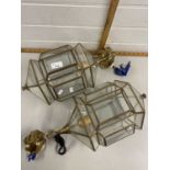 A pair of brass mounted clear glass lanterns