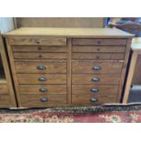 Modern light oak fourteen drawer chest, 112cm wide