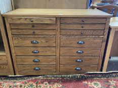 Modern light oak fourteen drawer chest, 112cm wide