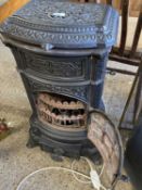 Vintage cast iron French stove with later conversion to a light fitting