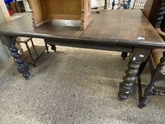 An early 20th Century oak dining table raised on barley twist legs, 146cm wide