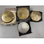 Collection of four various powder compacts