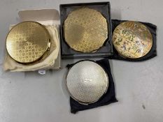 Collection of four various powder compacts