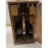 Leitz Wetzlar lacquered brass monocular microscope with wooden carry case, worn condition