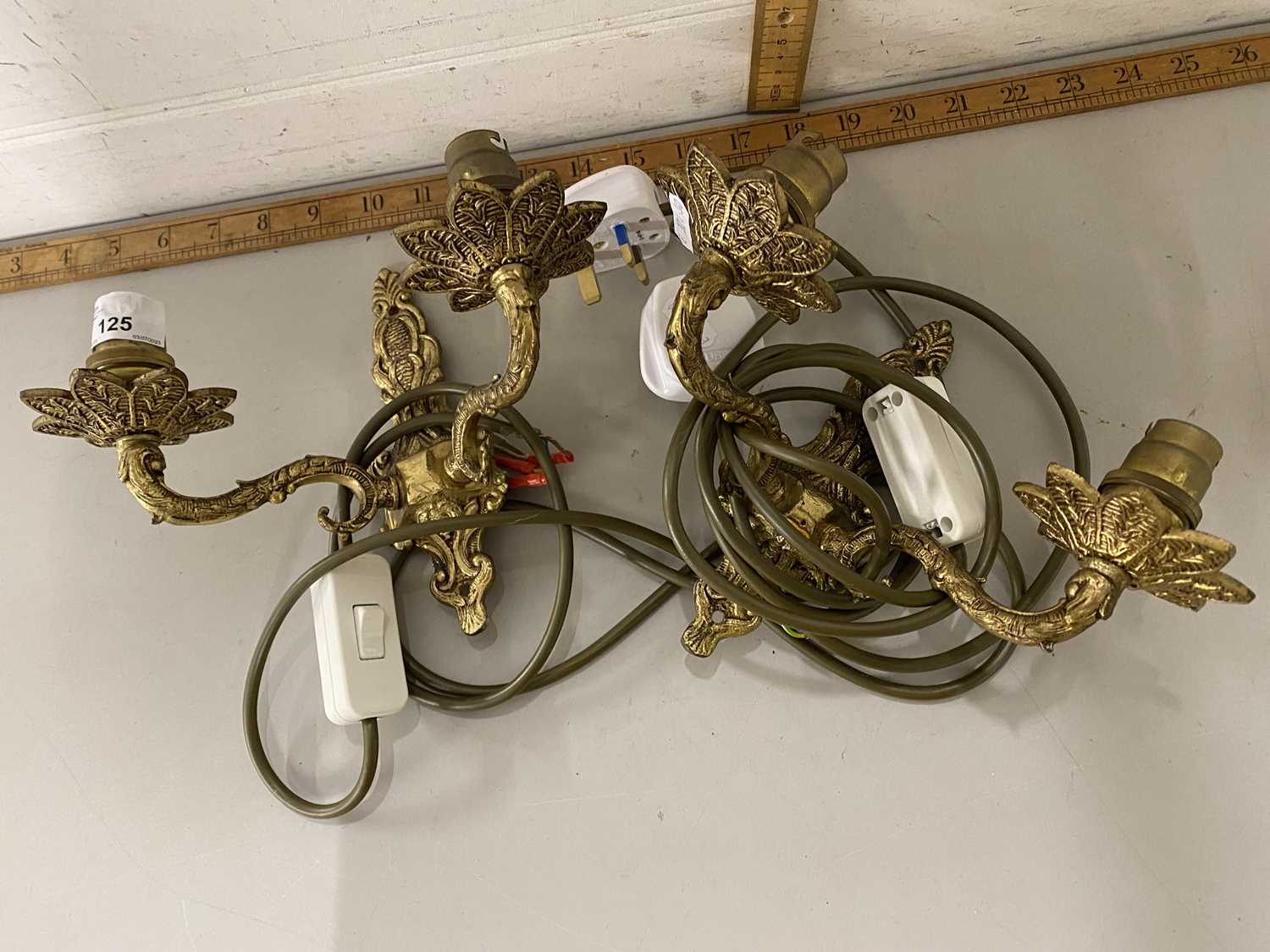 A pair of double light wall sconces