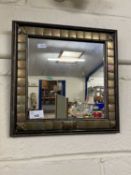 Modern wall mirror in metal mounted frame