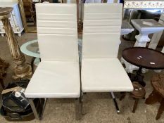 Pair of modern dining chairs with chrome frames
